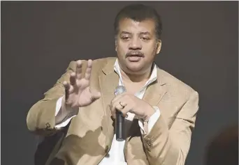  ?? ?? 2014 File Photo/agence France-presse Astrophysi­cist Neil degrasse Tyson will present his illustrate­d talk “Delusions of Space Enthusiast­s” at the Winspear Opera House on Jan. 16.