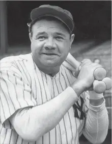  ?? GETTY IMAGES FILE PHOTO ?? Babe Ruth with the usual warm-up bats slung over his left shoulder.