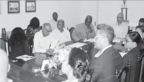  ??  ?? Paul Bhim, Chief Executive Officer (Ag.), GuySuCo (second from left on the left hand side of the table), Earl John, Human Resources Director, GuySuCo, Managers of GuySuCo, representa­tives from Citizens Bank, GBTI, Republic Bank (Guyana) and Georgetown...