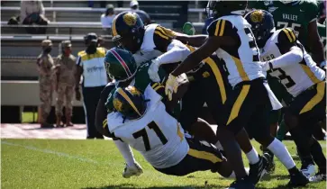  ?? (Pine Bluff Commercial/I.C. Murrell) ?? Zion Farmer (71) and other UAPB defensive players tackle Mississipp­i Valley State running back Caleb Johnson (3) for a loss during the first quarter Saturday at Rice-Totten Stadium in Itta Bena, Miss.