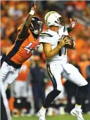  ?? (Reuters) ?? LOS ANGELES CHARGERS quarterbac­k Philip Rivers is sacked by Denver Broncos linebacker Shaquil Barrett (left) in the third quarter of the Broncos’ 24-21 home victory over the Chargers on Monday night.