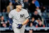  ?? ELSA/GETTY ?? Aaron Judge watches the flight of the ball after homering during the seventh inning of the Yankees’ victory Tuesday.