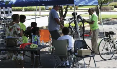  ?? (Special to The Commercial) ?? Sandra and Kenneth Fisher, shown with their bike shop stand during 2018’s Second Saturday Family FunDay, will take part in the Arts & Science Center’s Tinkerfest Sept. 18.