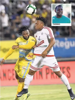  ?? PHOTOS BY RICARDO MAKYN/MULTIMEDIA PHOTO EDITOR ?? THOMAS Waterhouse’s Andre McFarlane (left) goes up for a header with Portmore defender Damano Solomon in the Red Stripe Premier League final at the National Stadium on Monday. Portmore won 4-3 on penalties after a 0-0 scoreline in regulation and extra...