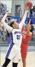  ?? Jeremy Stewart / RN-T ?? Model’s Victaria Saxton (25) blocks a shot by Dodge County’s Zannesia Mitchell during Tuesday’s game in the Class AA Elite Eight at Model.