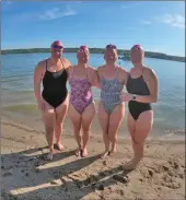  ?? Photo courtesy of Meghan Chisholm ?? The four members of the relay team that completed a long-distance relay swim at Last Mountain Lake. From left to right, Meghan Chisholm, Kelsey and Adrien van Dyke, and Dionne Tatlow.