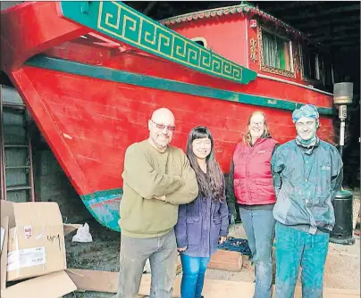  ?? SUBMITTED PHOTO ?? The crew takes a break from preparing Hai Long for her new duties as a tour vessel. From left are owners Montgomery Gisborne and Luo Danni and staff Shannon Burnside and Ryan Harris.