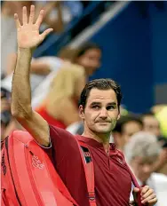  ?? AP ?? Roger Federer bids farewell to the 2018 US Open after his shock defeat in the third round to fired up Australian John Millman, below.
