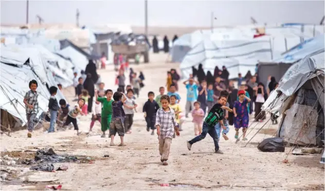  ?? Associated Press / File ?? Children gather outside their tents at Al Hol camp, which houses families of members of Daesh group, in Hasakeh province of Syria.