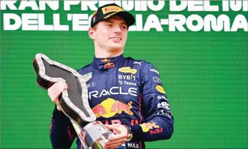  ?? AFP ?? First-placed Red Bull Racing’s Dutch driver Max Verstappen celebrates on the podium after the Emilia Romagna Formula One Grand Prix at the Autodromo Internazio­nale Enzo e Dino Ferrari.