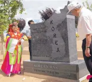  ?? ADOLPHE PIERRE-LOUIS/JOURNAL ?? Kim Young and Medal of Honor recipient Hiroshi Miyamura attend the unveiling of the Korean War Monument at the New Mexico Veterans Memorial in Albuquerqu­e in 2008.