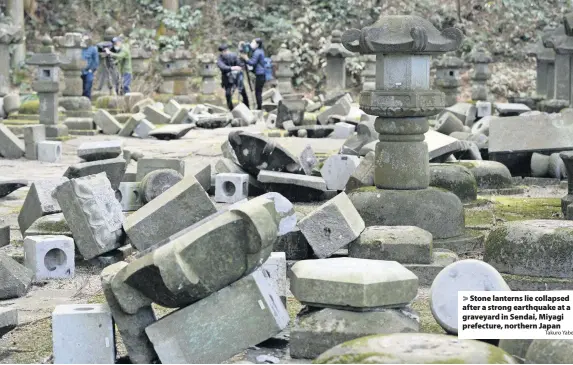  ?? Takuro Yabe ?? Stone lanterns lie collapsed after a strong earthquake at a graveyard in Sendai, Miyagi prefecture, northern Japan