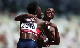  ?? Photograph: Patrick Smith/Getty Images ?? Daryll Neita and Dina Asher-Smith of Team GB hug after coming first in round one of the women’s 4x100m heats at Tokyo’s Olympic Stadium.