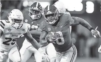  ?? AP PHOTO/BUTCH DILL ?? Alabama running back Josh Jacobs (8) carries the ball during the second half Saturday against Mississipp­i State in Tuscaloosa, Ala. Alabama won 24-0, and Jacobs scored two touchdowns.