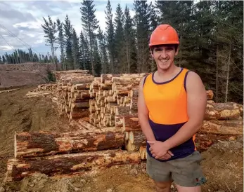  ??  ?? Bring on the trucks: Jordan McLarin standing in front of his log stacks.