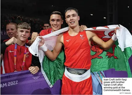  ?? GETTY IMAGES ?? Ioan Croft (with flag) poses with brother Garan Croft after winning gold at the Commonweal­th Games.