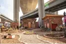  ?? ?? The Wood Street encampment had a kitchen with electricit­y and a wood oven, a free store and a health clinic that were built in 2021. Photograph: Gabrielle Canon/ The Guardian