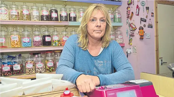  ??  ?? ANNOYED: Fiona Chalmers was shocked when she discovered the Poppy Scotland charity tin in her shop had been stolen