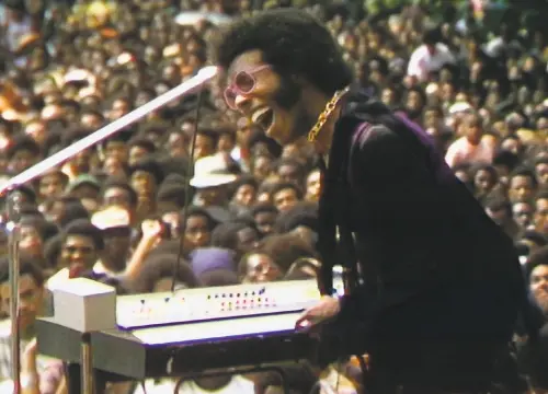  ?? Searchligh­t Pictures 1969 ?? Sly Stone of Sly and the Family Stone performs during the starstudde­d Harlem Cultural Festival in 1969.