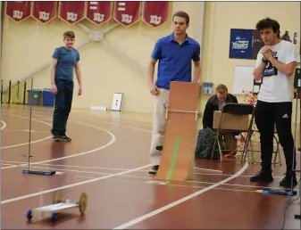  ?? LISA MITCHELL — MEDIANEWS GROUP ?? Exeter seniors Christophe­r Good and Nicolas Ciabattoni participat­ing in the Gravity Vehicle event at Berks Science Olympiad at Kutztown University on Jan. 9.