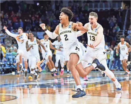  ?? PETER G. AIKEN/USA TODAY SPORTS ?? Michigan guard Jordan Poole hit a shot at the buzzer to beat Houston, putting the Wolverines in the Sweet 16.