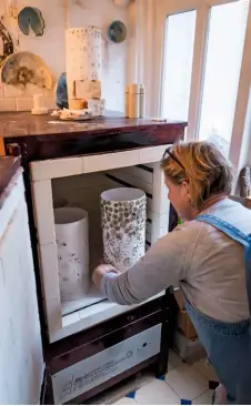  ??  ?? Firing the lamps in the kiln is a 12-hour process.