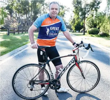  ??  ?? Brett Smith is riding his bike this month to riase funds for children’s cancer research.