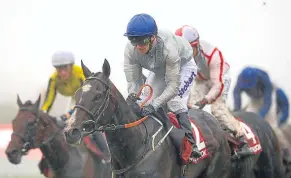  ?? Picture: PA. ?? Londinium, ridden by Joe Fanning, on his way to winning the Better Odds With Matchbook Betting Exchange Handicap during day two of the Qatar Goodwood Festival.