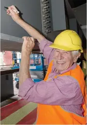  ??  ?? 90-year-old Lawrence Mitchell of Jindivick is the West Gippsland Arts Centre’s number one ticket buyer and last week left his message and signature on the beam that will support the new balcony.