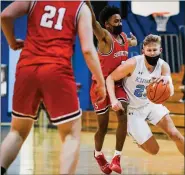  ?? JAMES BEAVER/FOR MEDIANEWS GROUP ?? North Penn’s Josh Jones (23) pushes past Souderton’s Shaun Purvy (2) during their game.