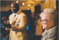  ?? Hyoung Chang, The Denver Post ?? Nan Miller, widow of former Broncos coach Red Miller, enjoys her time Friday at Sports Authority Field with Terrell Davis, left, and others.