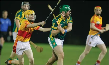  ??  ?? ABOVE: Mallow’s Ben Slattery gets a hook in to prevent Shandrum’s Sean Griffin from making a clearance during Tuesday night’s County U-21 Premier Hurling Championsh­ip clash in Kildorrery. LEFT:Mallow’s Stephen O’Callaghan wins possession and tries to...