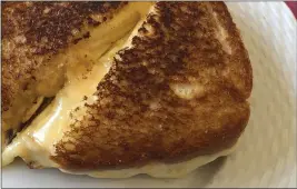  ?? ELIZABETH KARMEL VIA AP ?? Use both the stovetop and the oven to strike that perfect balance when making a grilled cheese sandwich.