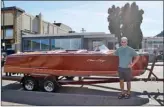  ?? MELANIE EKSAL/The Okanagan Weekend ?? Jim Cooper poses in front of a six-metre 1951 Criss Craft Riviera in anticipati­on of today’s Okanagan Antique and Classic Boat Society show at the Penticton Lakeside Resort.