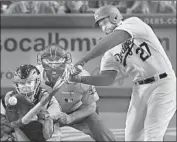  ?? Mark J. Terrill Associated Press ?? MATT KEMP, appealing his one-game suspension for exchanging shoves with Texas’ Robinson Chirinos, hits a solo home run in the fourth inning Friday.