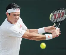  ?? BEN CURTIS THE ASSOCIATED PRESS ?? Milos Raonic of Canada returns to Mackenzie McDonald of the U.S. during their men’s singles match at the Wimbledon Tennis Championsh­ips in London on Monday. Raonic won, 6-3, 6-4, 6-7 (5), 6-2, advancing to the quarter-finals.