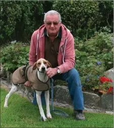  ??  ?? Joseph Driscoll, from the Portmagee Club with his senior pup Lottie, winner of the Pound Club Drag Hunt.