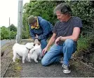  ??  ?? Crib owners Brenda Duncan, left, and Karl Thomson, out with their dogs waiting for the cars to arrive.