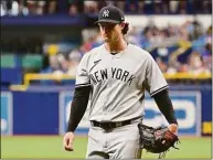  ?? Julio Aguilar / Getty Images ?? The Yankees’ Gerrit Cole walks off the field after the first inning against the Tampa Bay Rays at Tropicana Field on Saturday.