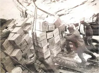  ?? ?? Unloading supplies of much-needed essentials in 1943. ALL IMAGES FROM THE AUTHOR’S COLLECTION­S