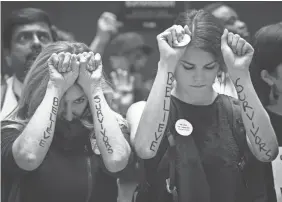  ?? PHOTOS BY JACK GRUBER/USA TODAY ?? Protesters demonstrat­e in the Hart Senate Office Building as Christine Blasey Ford testifies Thursday on Capitol Hill.