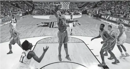  ?? CHARLIE RIEDEL/AP ?? Oregon forward Dillon Brooks (24) grabs a rebound in front of Kansas guard Josh Jackson (11) during the first half of the Midwest Regional final on Saturday in Kansas City, Mo.