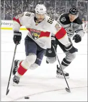  ?? REED SAXON / AP ?? Panthers right winger Jaromir Jagr skates past Kings defenseman Brayden McNabb during the first period of their game Saturday night in Los Angeles.