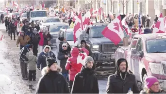  ?? - Archives ?? Début février 2022, le centre-ville d’Ottawa a été assiégé par des manifestan­ts, dont beaucoup se trouvaient à bord de gros camions, qui étaient arrivés dans la capitale à partir de la fin janvier.