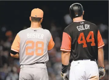  ?? JENNIFER STEWART — GETTY IMAGES ?? Buster Posey and Arizona’s Paul Goldschmid­t wear their nicknames on their backs during Players’ Weekend.