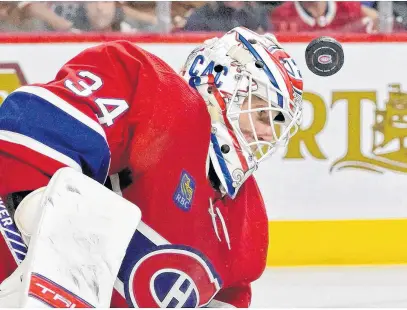  ?? USA TODAY SPORTS ?? Montreal Canadiens goalie Jake Allen gets hit in the mask during the third period against the Pittsburgh Penguins at the Bell Centre in Montreal on Nov. 12.