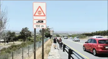  ?? PICTURES: HENK KRUGER/AFRICAN NEWS AGENCY/ANA ?? Eric Baker speaks to the Weekend Argus at the bottom of Ou Kaapse Weg, where a new stop sign has been installed. There is confusion whether the stop sign (pictured below) is only for trucks or compulsory for drivers with all types of vehicles. Baker was fined R1 500 for not stopping at this stop sign.