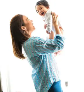  ??  ?? Mornings are for bonding with Sky. On Eshma: M&amp;S Collection top &amp; FlextFit jeggings.