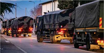  ??  ?? Convoy of the dead: Military vehicles transport victims through Bergamo yesterday