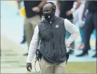  ?? LYNNE SLADKY — THE ASSOCIATED PRESS ?? Dolphins head coach Brian Flores walks the sidelines during the first half against the Seahawks on Oct. 4in Miami Gardens, Fla.